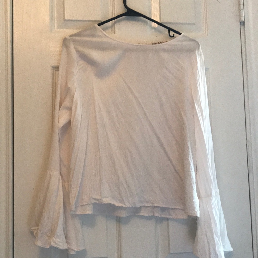 white blouse with flared sleeves